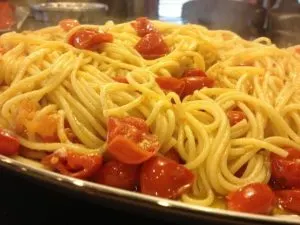 Spicy spaghetti with oil, garlic, cherry tomatoes and red pepper flakes.