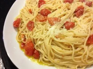 Spicy spaghetti with oil, garlic, cherry tomatoes and red pepper flakes.