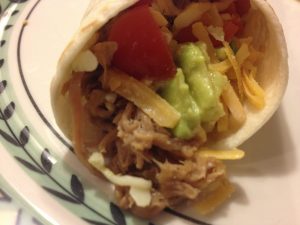 Wrap some in a warn tortilla with avocado, salsa and a little shredded monterey jack and cheddar cheeses.