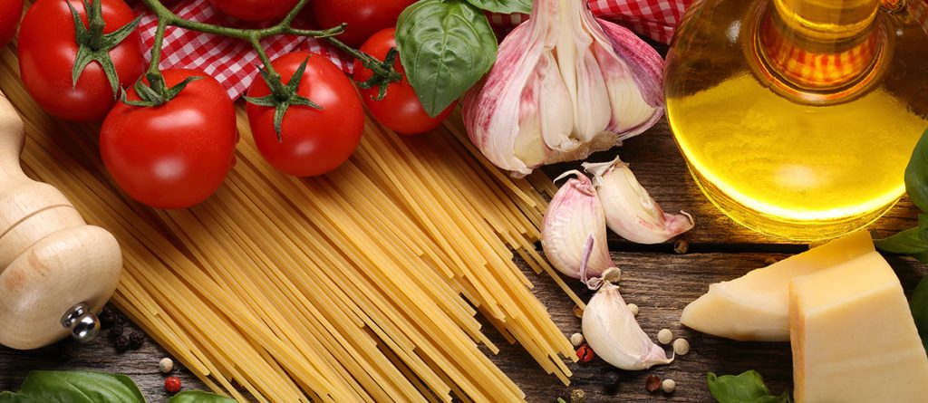 Italian food ingredients on wooden background